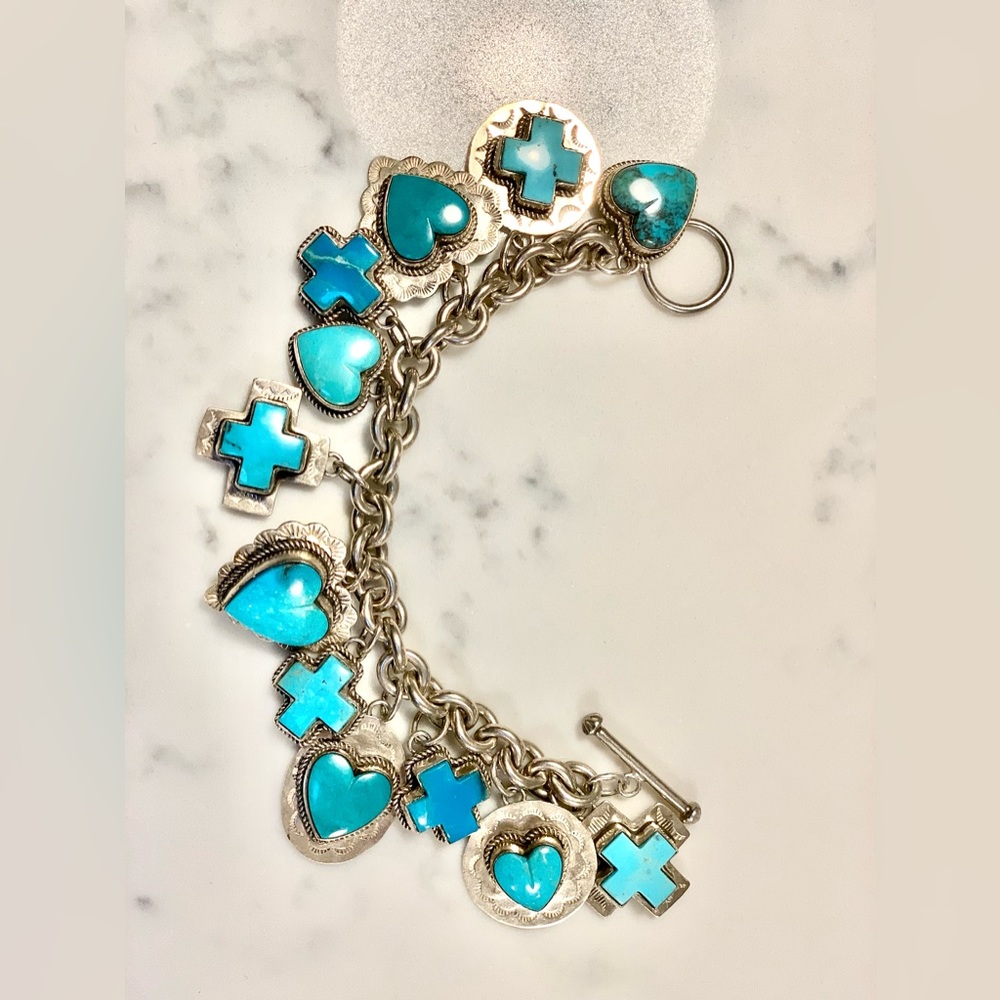 Joan Slifka turquoise charm bracelet with 12 charms.